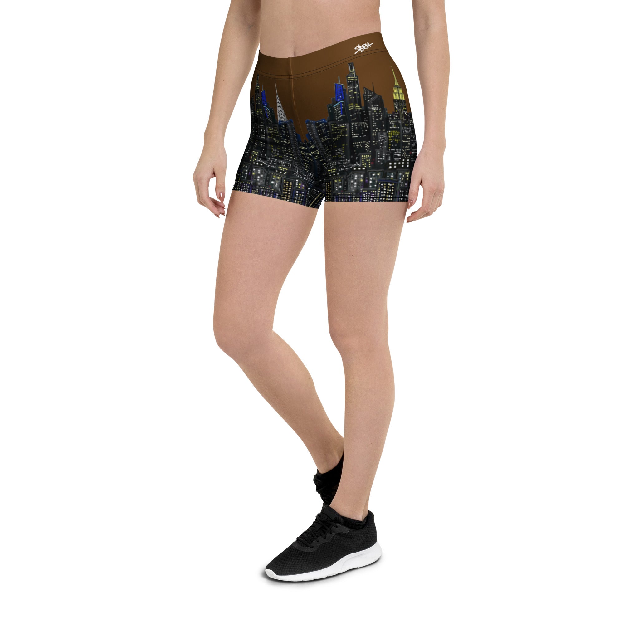 Person wearing shorts with a cityscape Loria NYC Art design on a white background