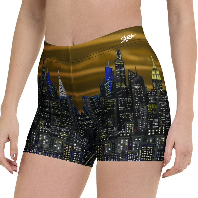 Person wearing shorts with a Loria NYC Art cityscape design on a white background