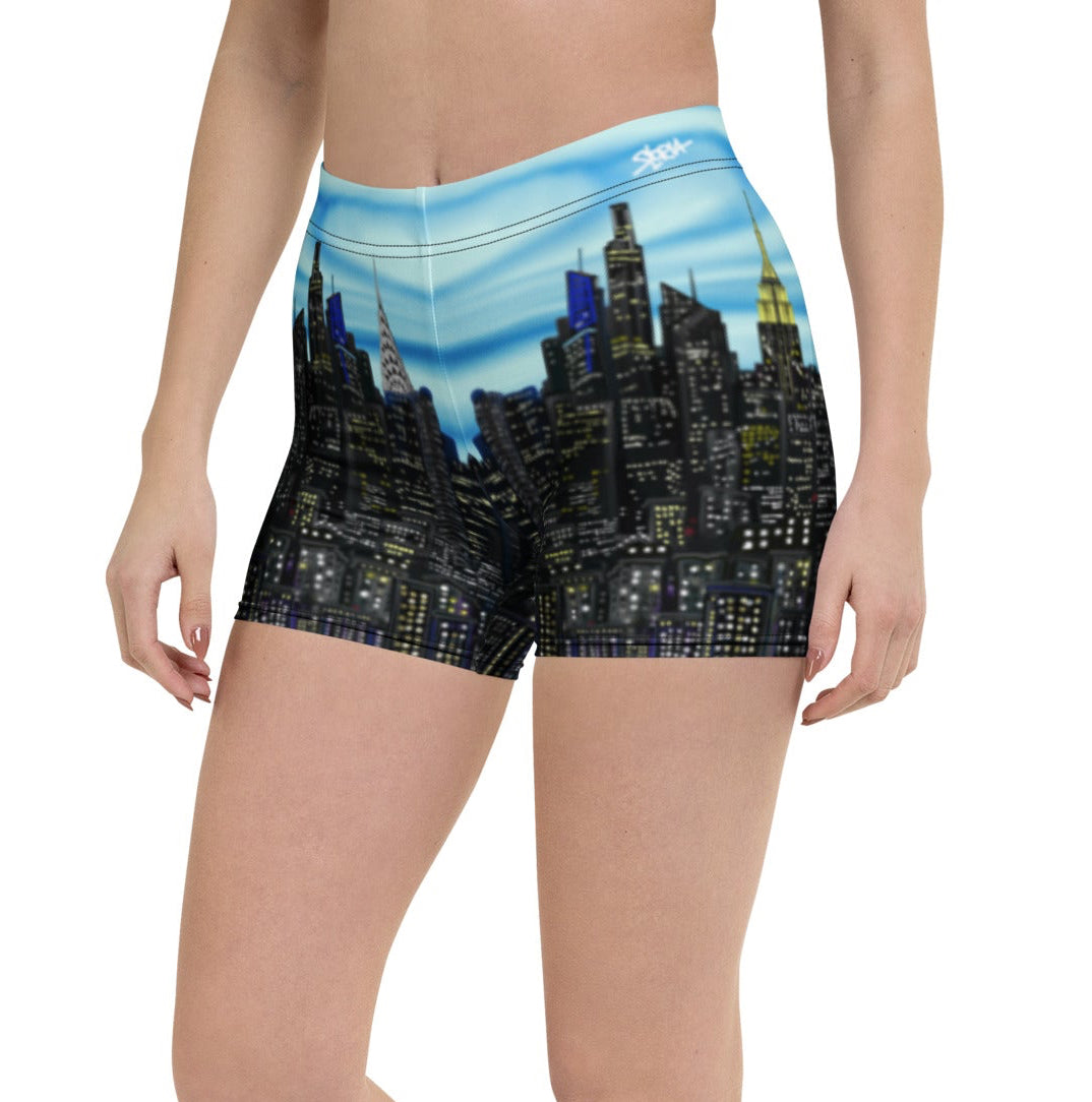 Person wearing shorts with a cityscape Loria NYC Art design on a white background