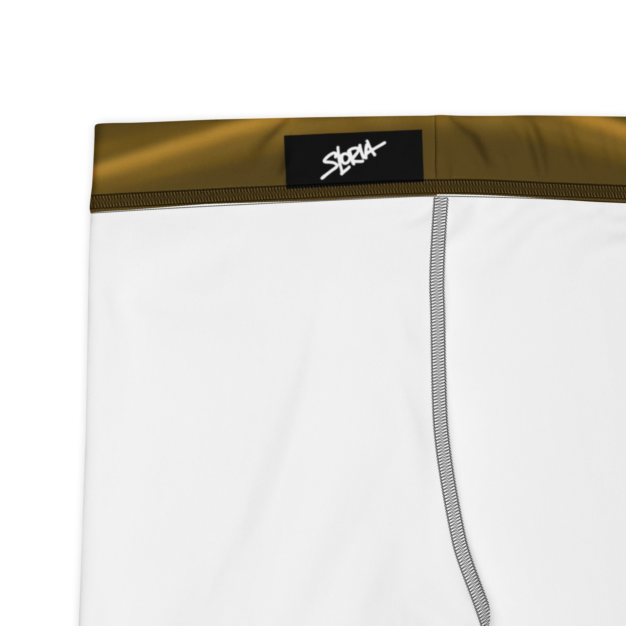 White boxer briefs with a gold waistband and black label on a white background