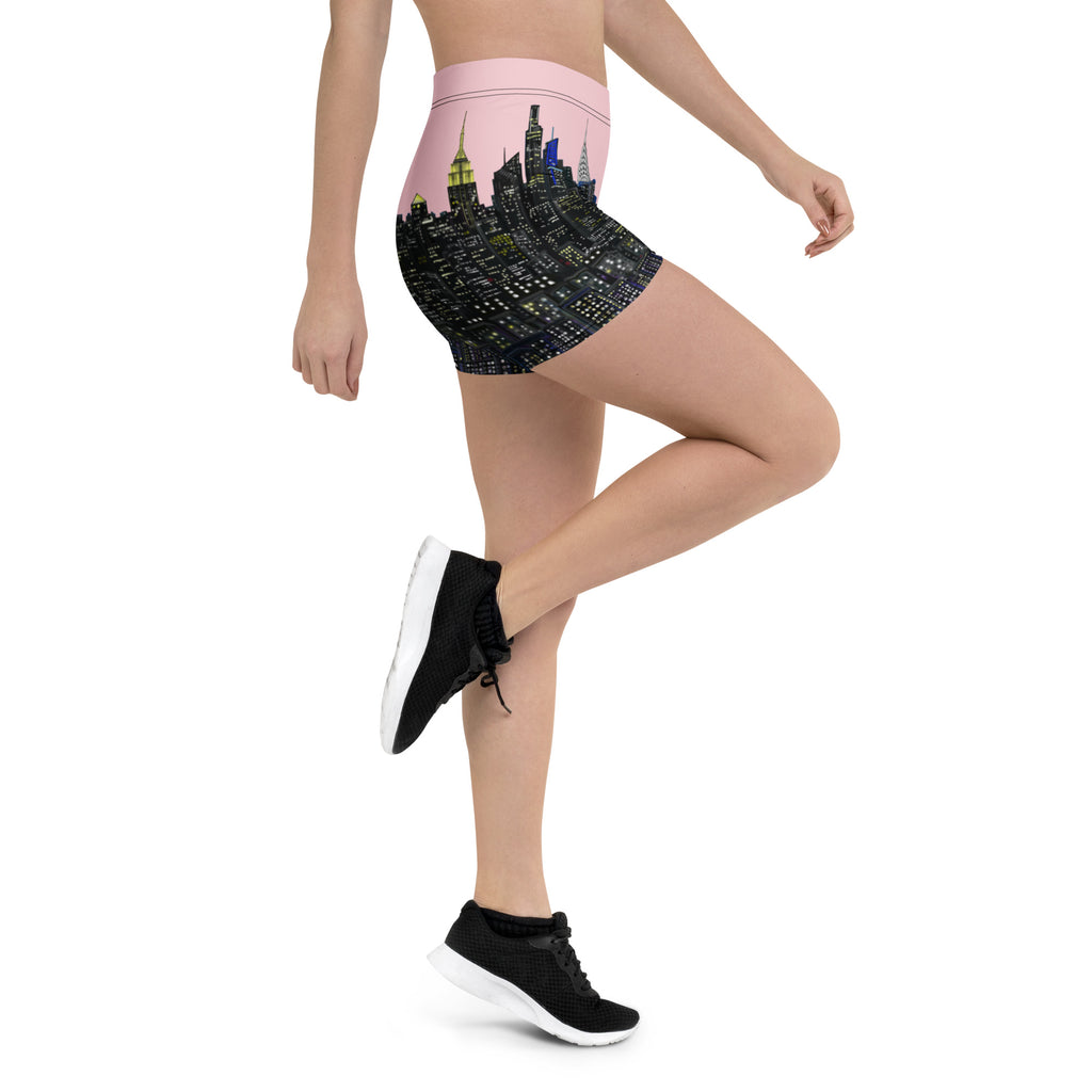 Person wearing a skirt with a Loria NYC Art cityscape design on a white background