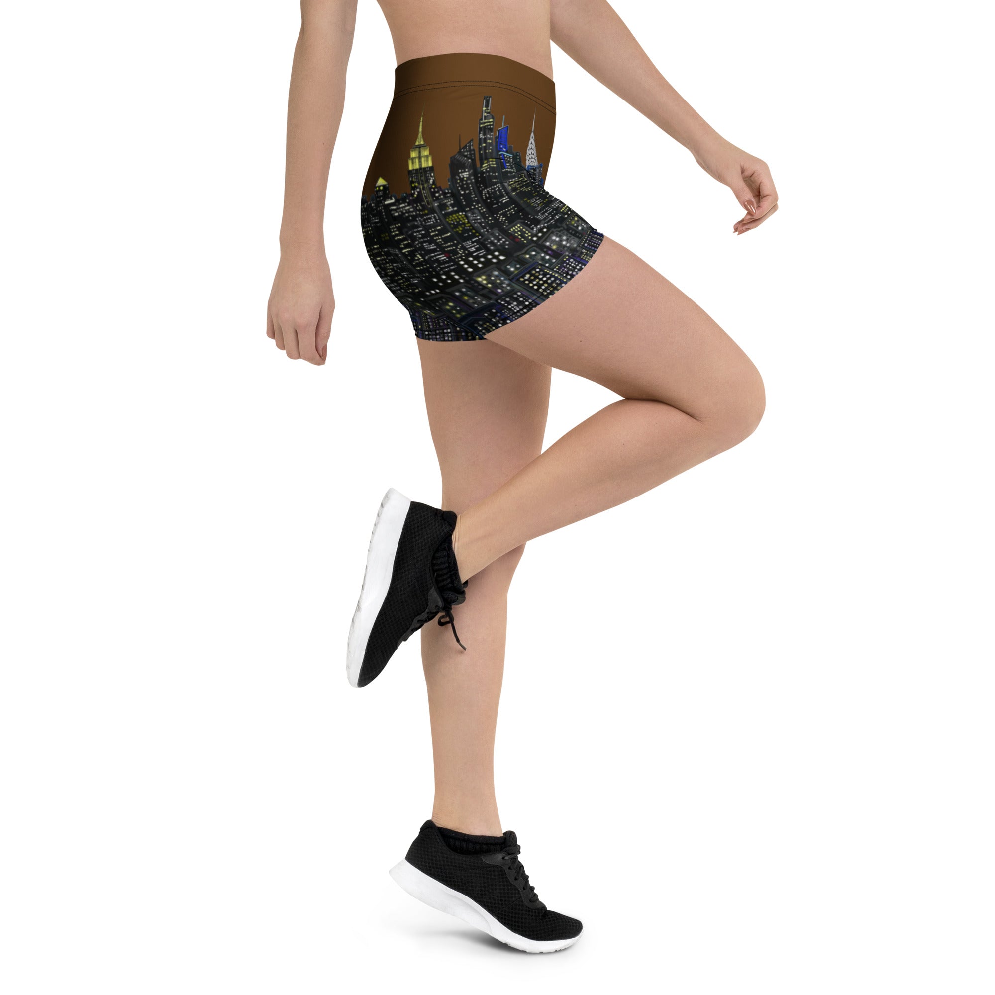 Person wearing high-waisted shorts with a cityscape Loria NYC Art design on a white background