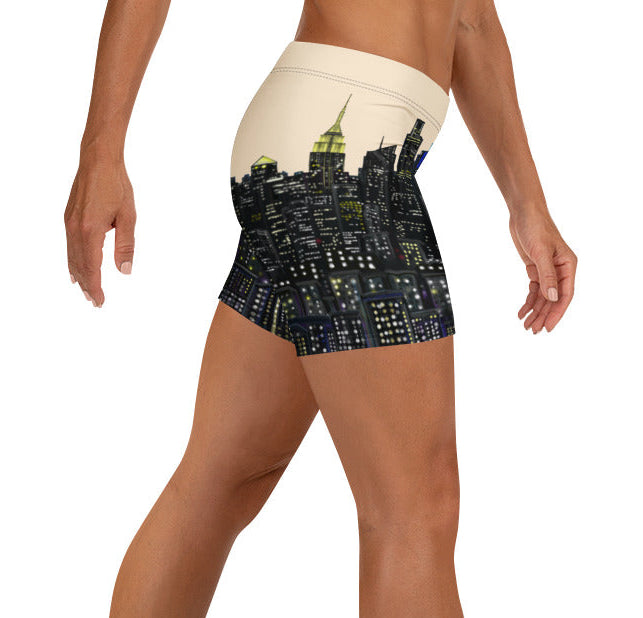 Person wearing a pair of shorts with a S.Loria NYC Art design on a white background