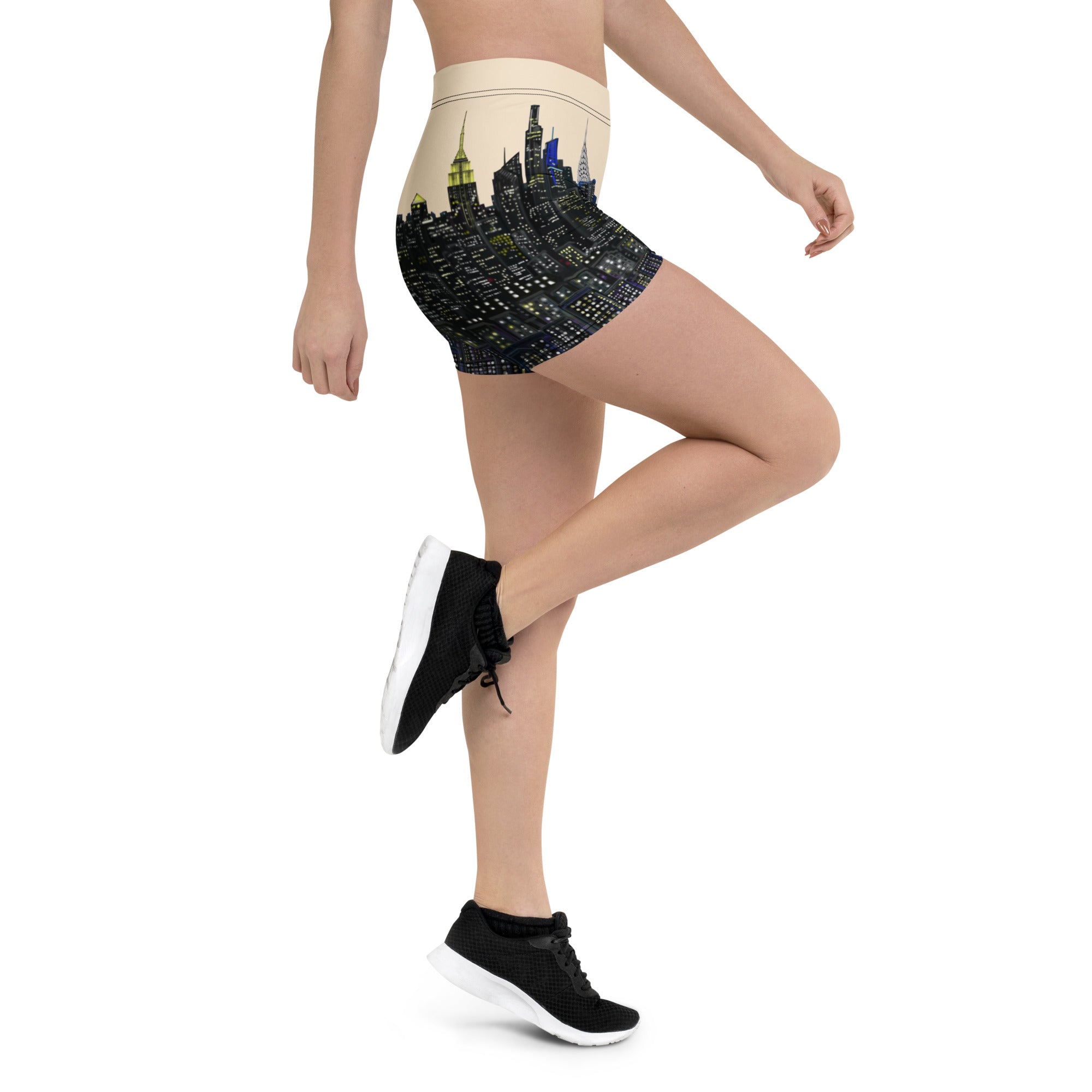 Person wearing high-waisted yoga shorts with a S.Loria NYC design on a white background