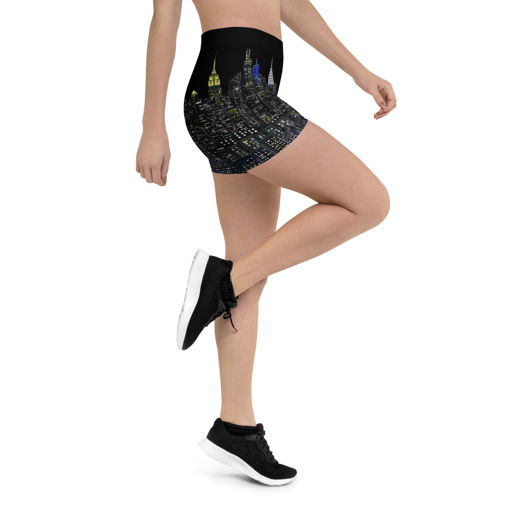 Person wearing black high-waisted shorts with cityscape Loria NYC Art design on a white background
