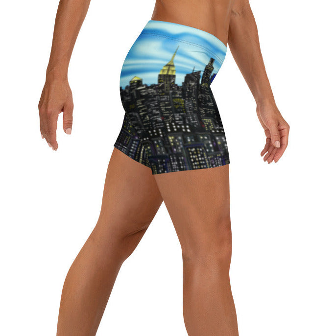 Shorts with a Loria NYC Art cityscape design on a white background