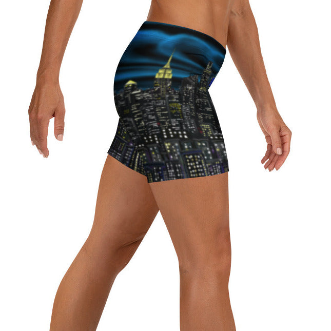 Person wearing a pair of shorts with a cityscape Loria NYC Art design on a white background