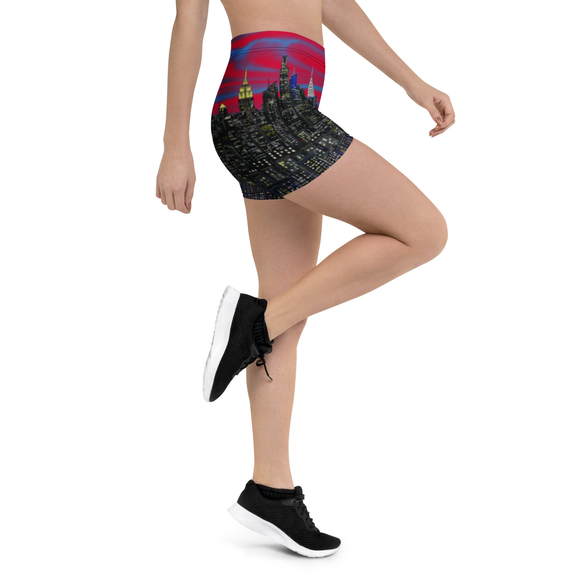 Person wearing a high-waisted shorts with a cityscape Loria NYC Art design on a white background