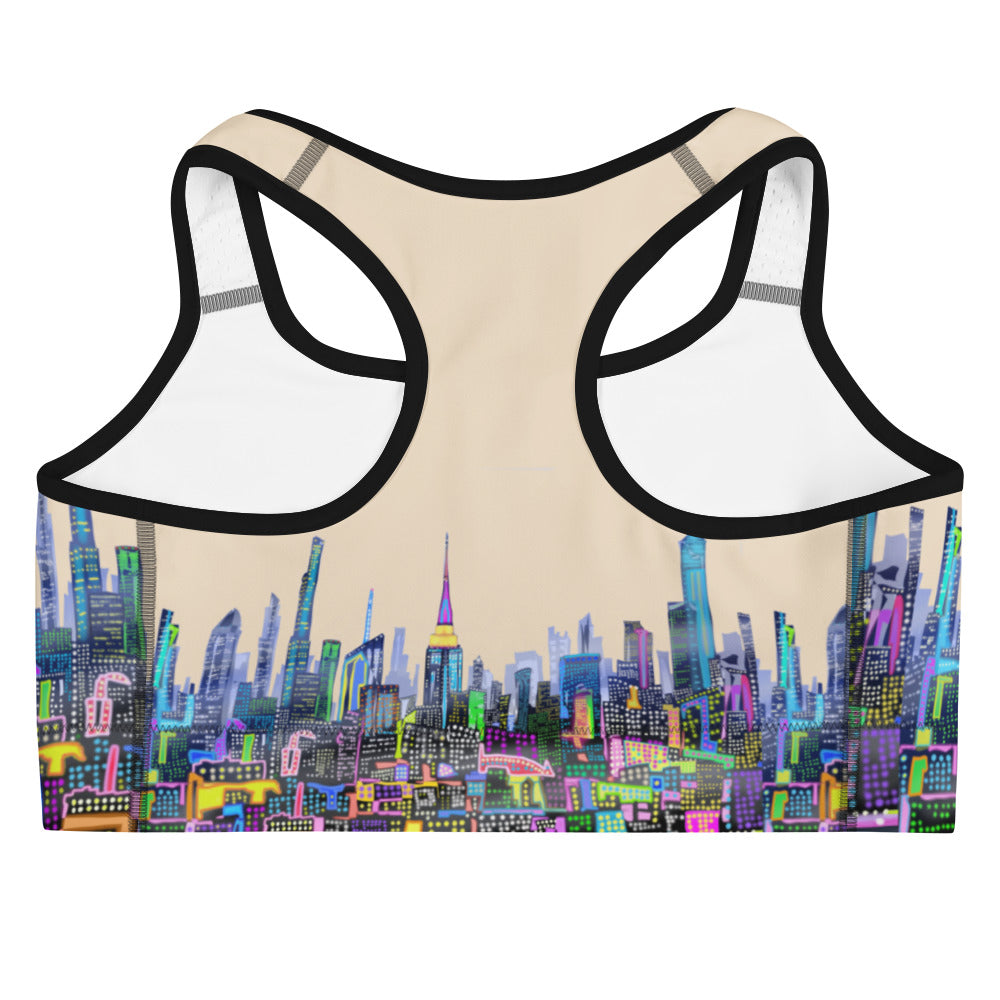 Back of Sports bra with colorful cityscape design on a beige background designed by Loria NYC Art 