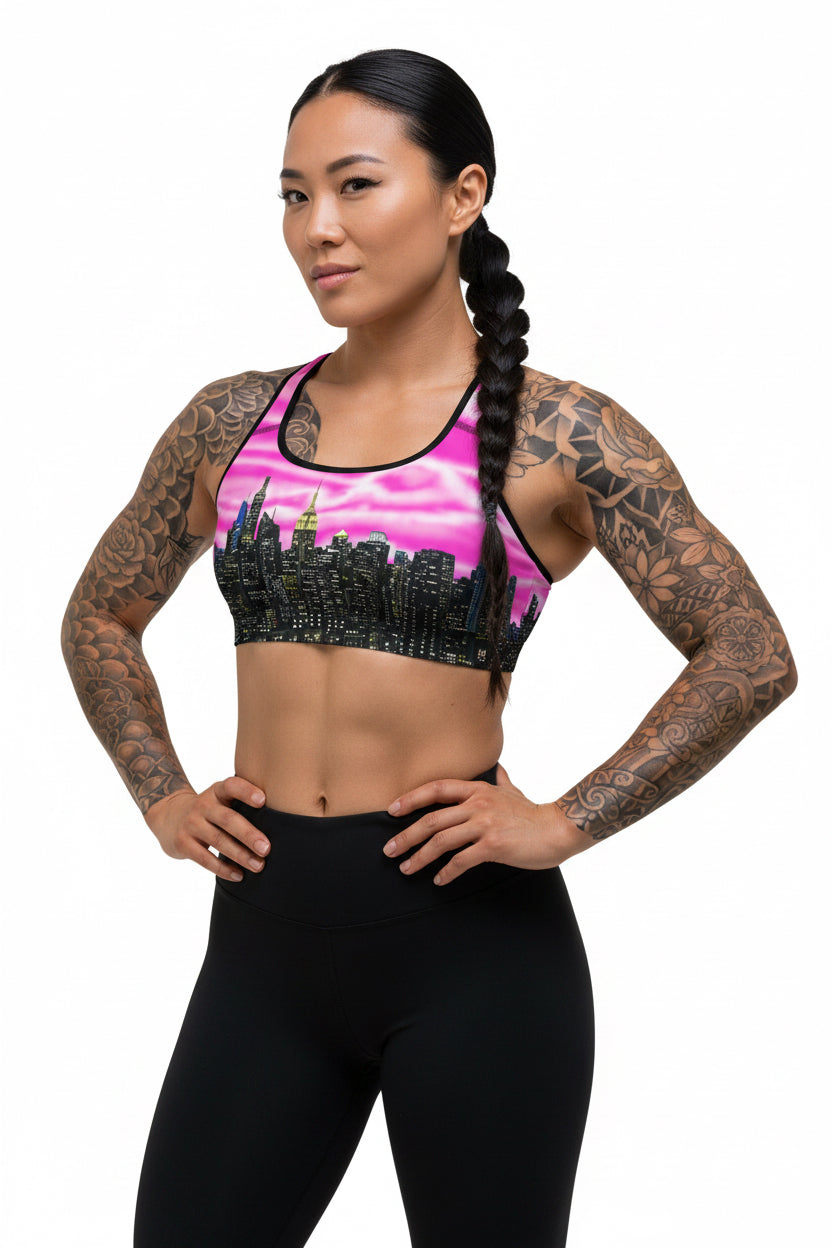 Women wearing Sports bra with cityscape design designed by Loria NYC Art on a white background