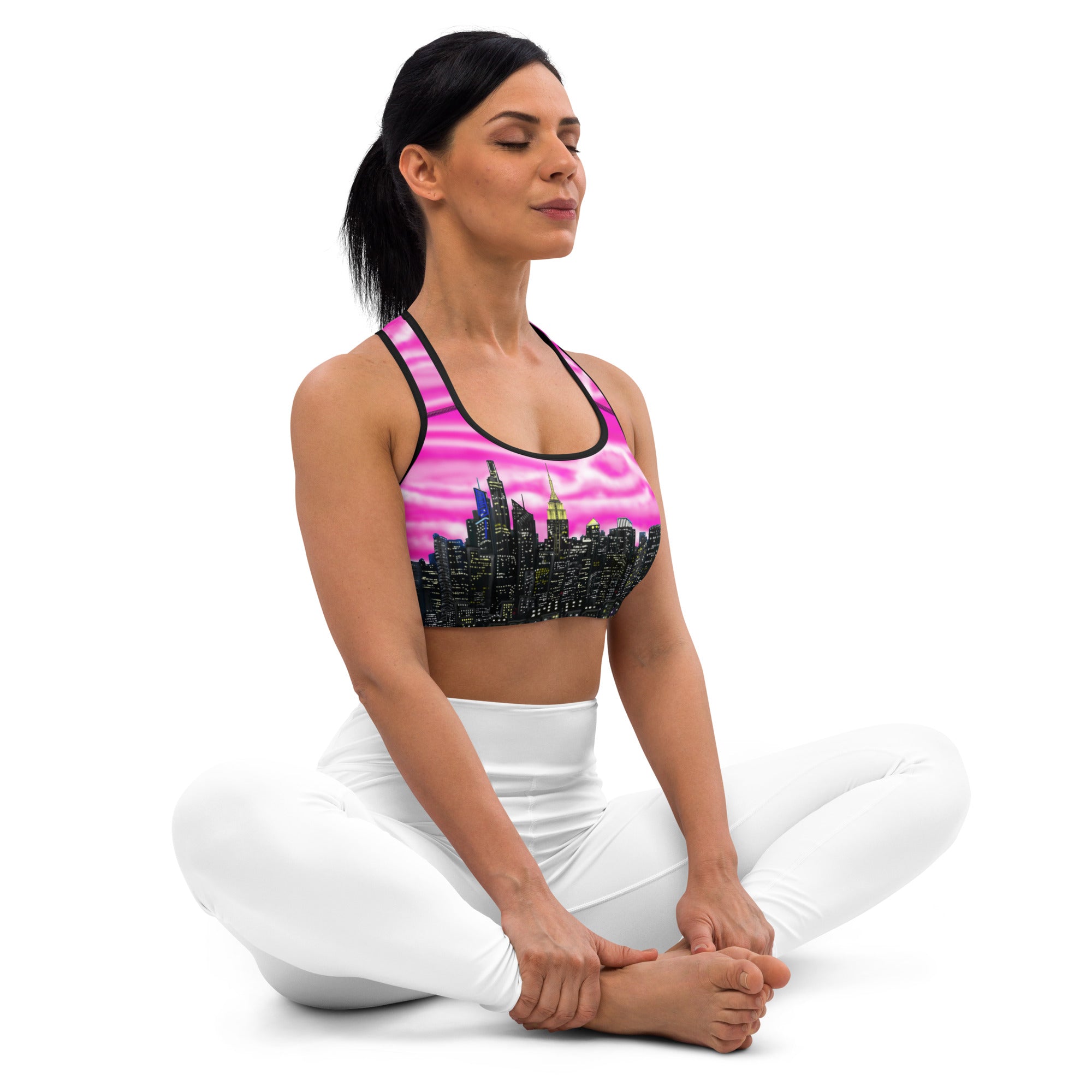 Women wearing Sports bra with cityscape design designed by Loria NYC Art on a white background