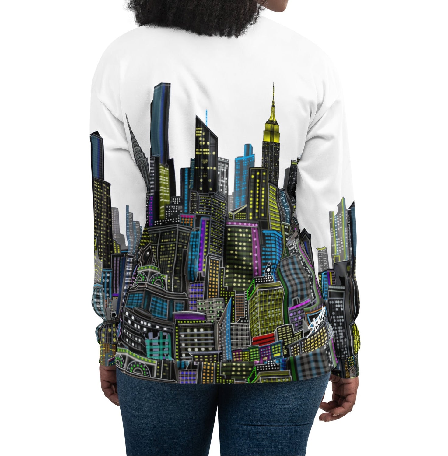 Back view of women wearing a White bomber jacket with a colorful cityscape designed by Loria NYC Art 