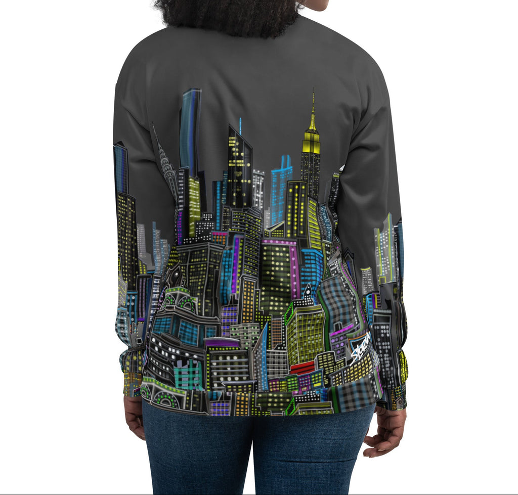 Back of Woman wearing a colorful cityscape jacket by Loria NYC Art on a white background
