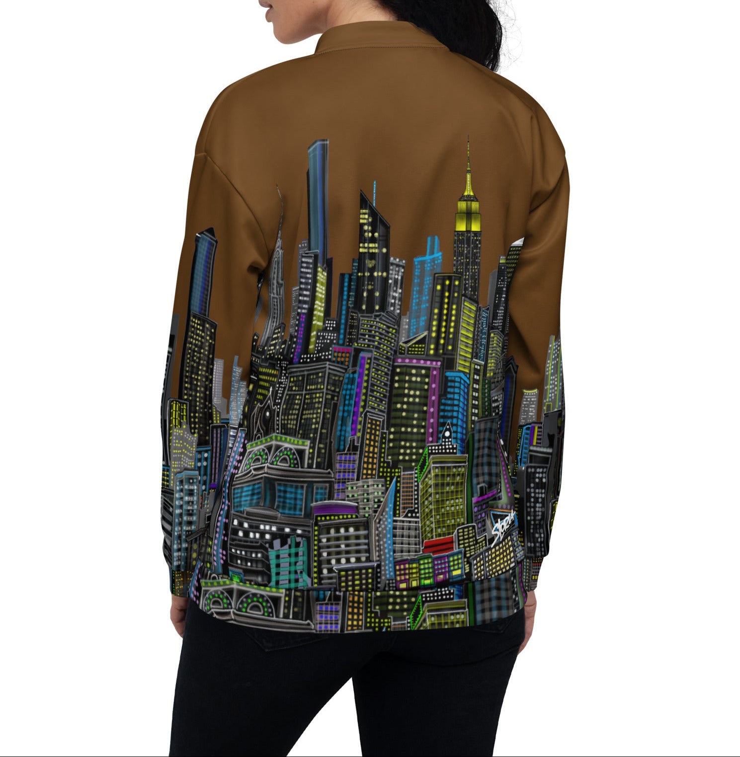 Person wearing a brown jacket with a colorful cityscape design on the back created by Loria NYC Art