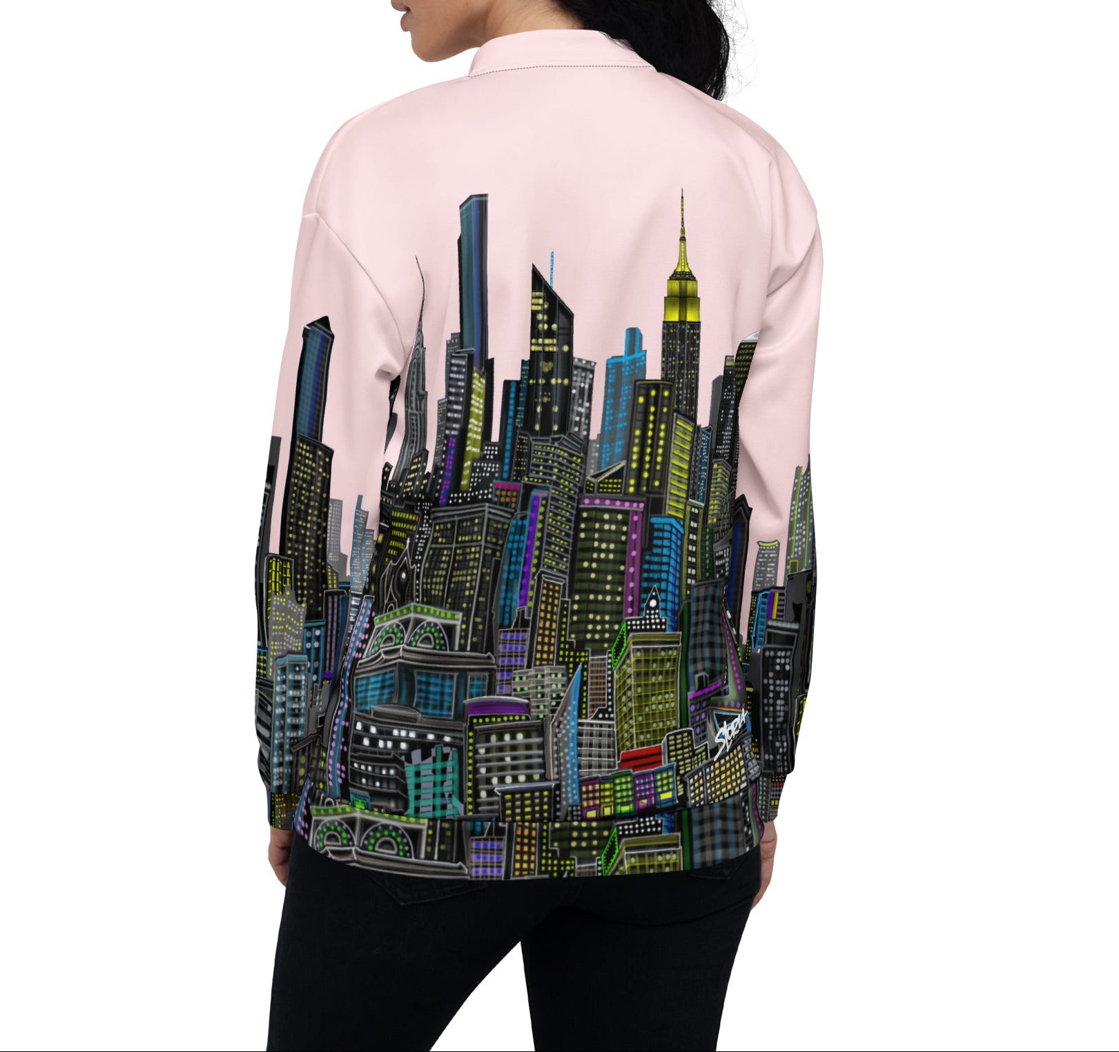 Back view of Person wearing a pink jacket with a cityscape design by Loria NYC Art on the back