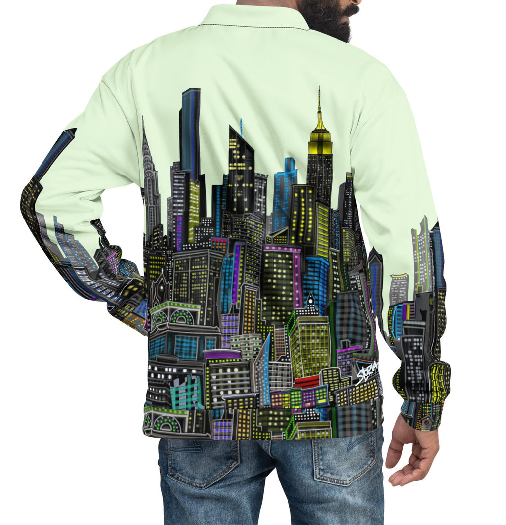 Person wearing a light green Loria NYC Art jacket with a colorful cityscape design on the back, standing against a white background.