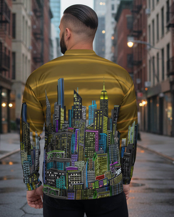 Man wearing a gold shirt with a cityscape design by Loria NYC Art on the back, on a urban background
