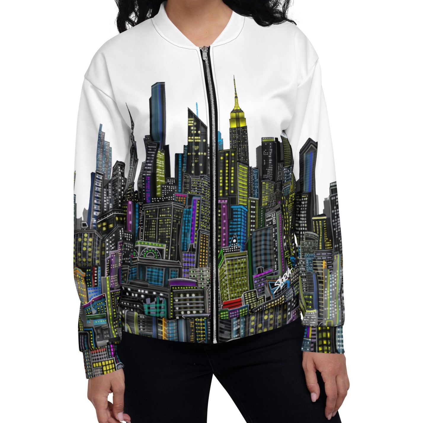 Girl wearing a White bomber jacket with a colorful cityscape designed by Loria NYC Art 