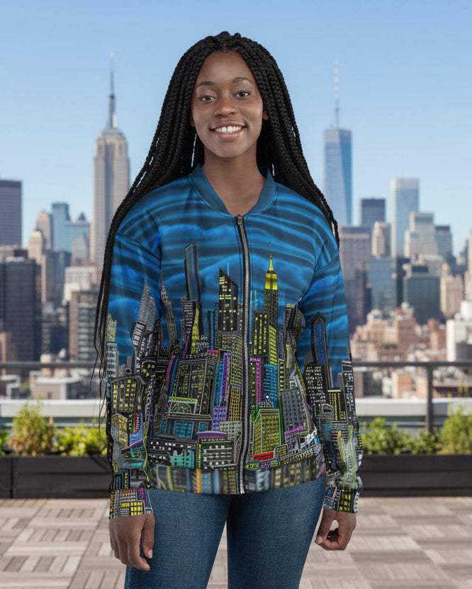 Lady wearing a colorful cityscape jacket designed by Loria NYC Art on a roof 