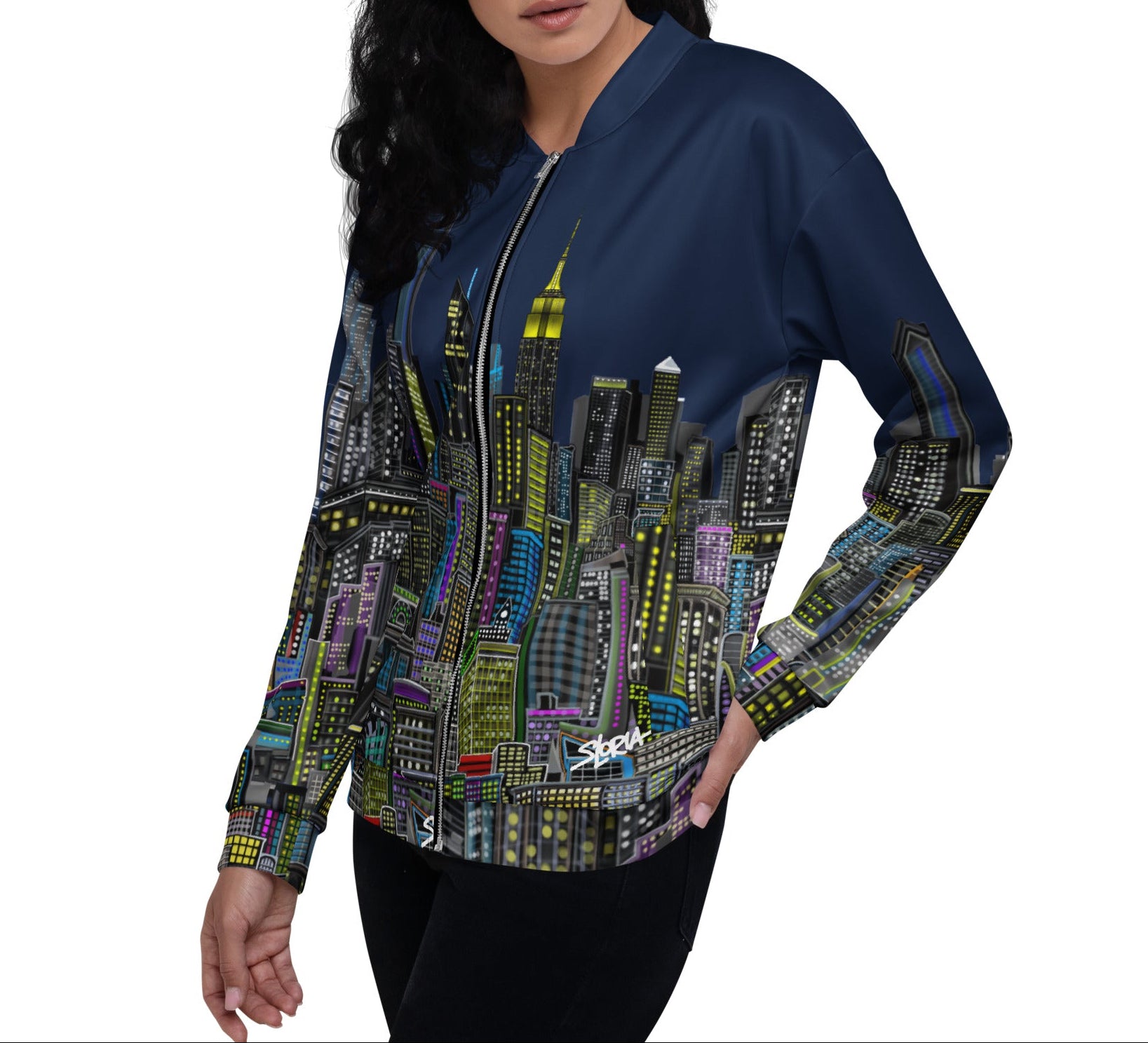 Woman wearing a navy blue bomber jacket with cityscape Loria NYC Art design on a white background