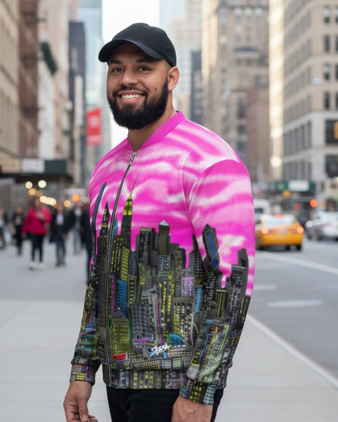 Man wearing a colorful cityscape jacket with pink sky and tall buildings designed by Loria NYC Art