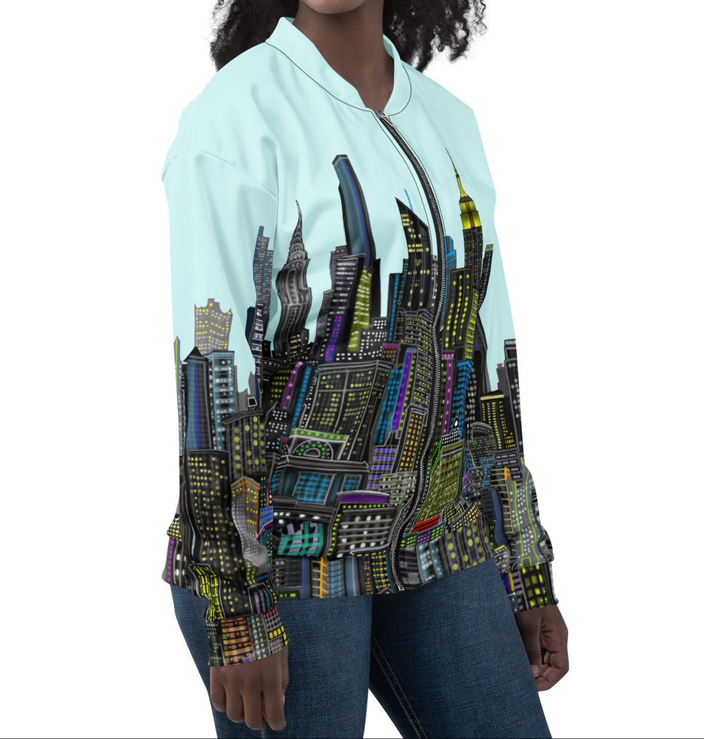 Side view of Woman wearing a bomber jacket with a colorful cityscape designed by Loria NYC Art on a white background