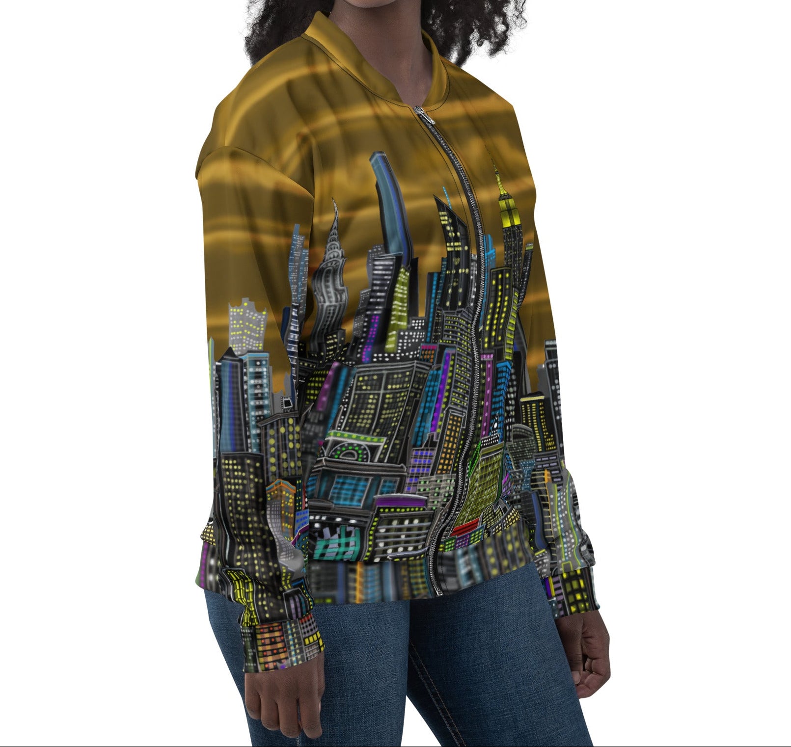 Woman wearing a gold bomber jacket with a cityscape design by Loria NYC Art on the back, on a white background