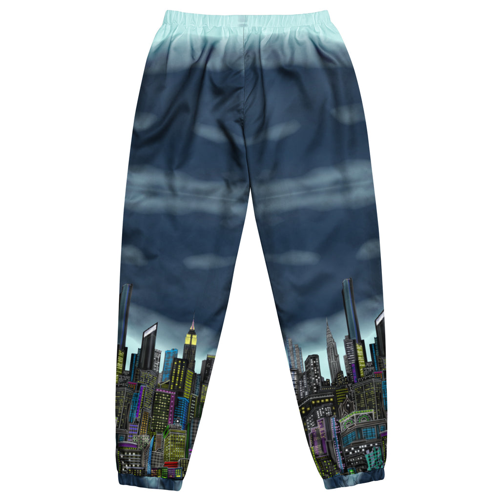 Back View of blue track pants with cityscape design by Loria NYC Art on a white background