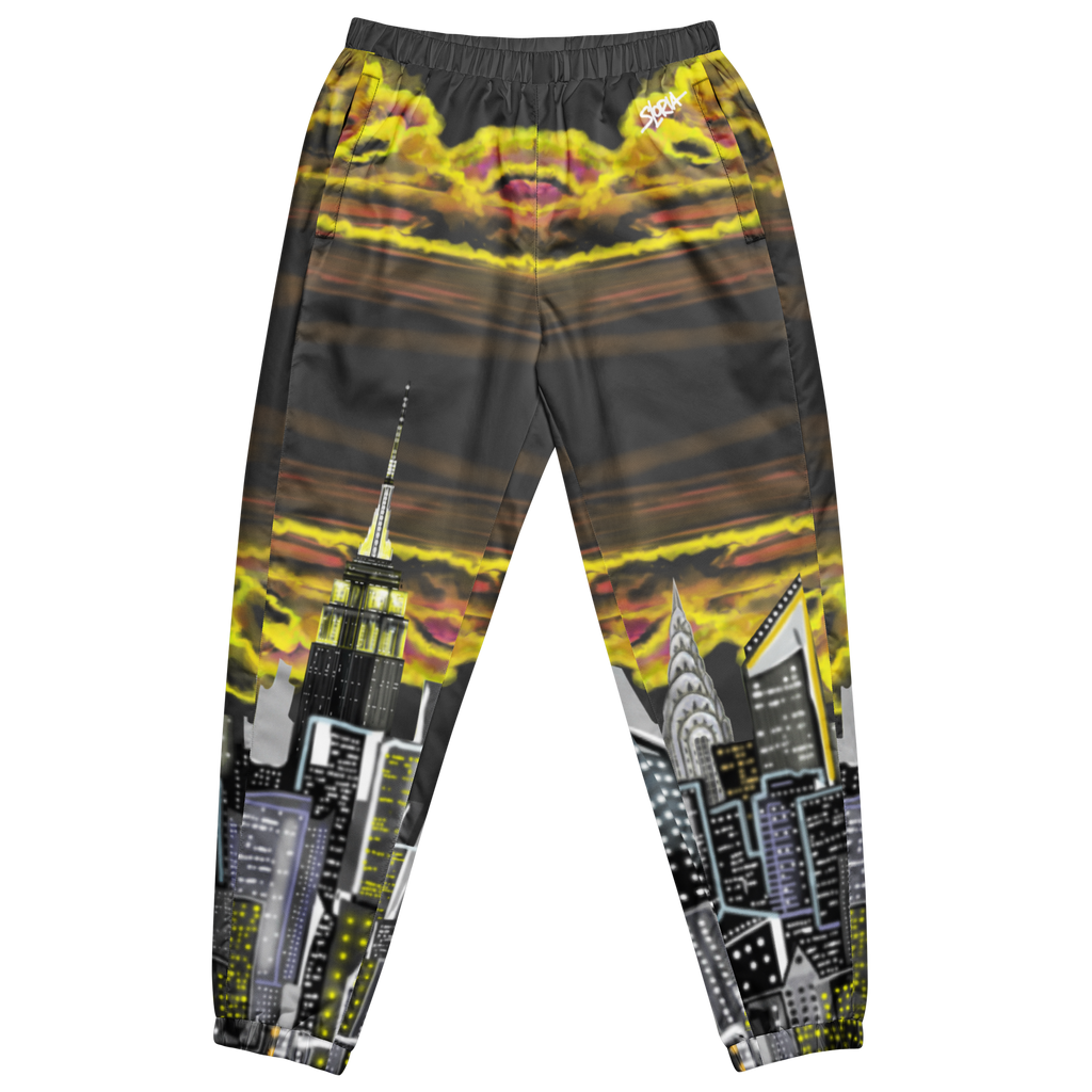 Pants with Loria NYC Art cityscape design featuring skyscrapers and a sunset, on a white background.