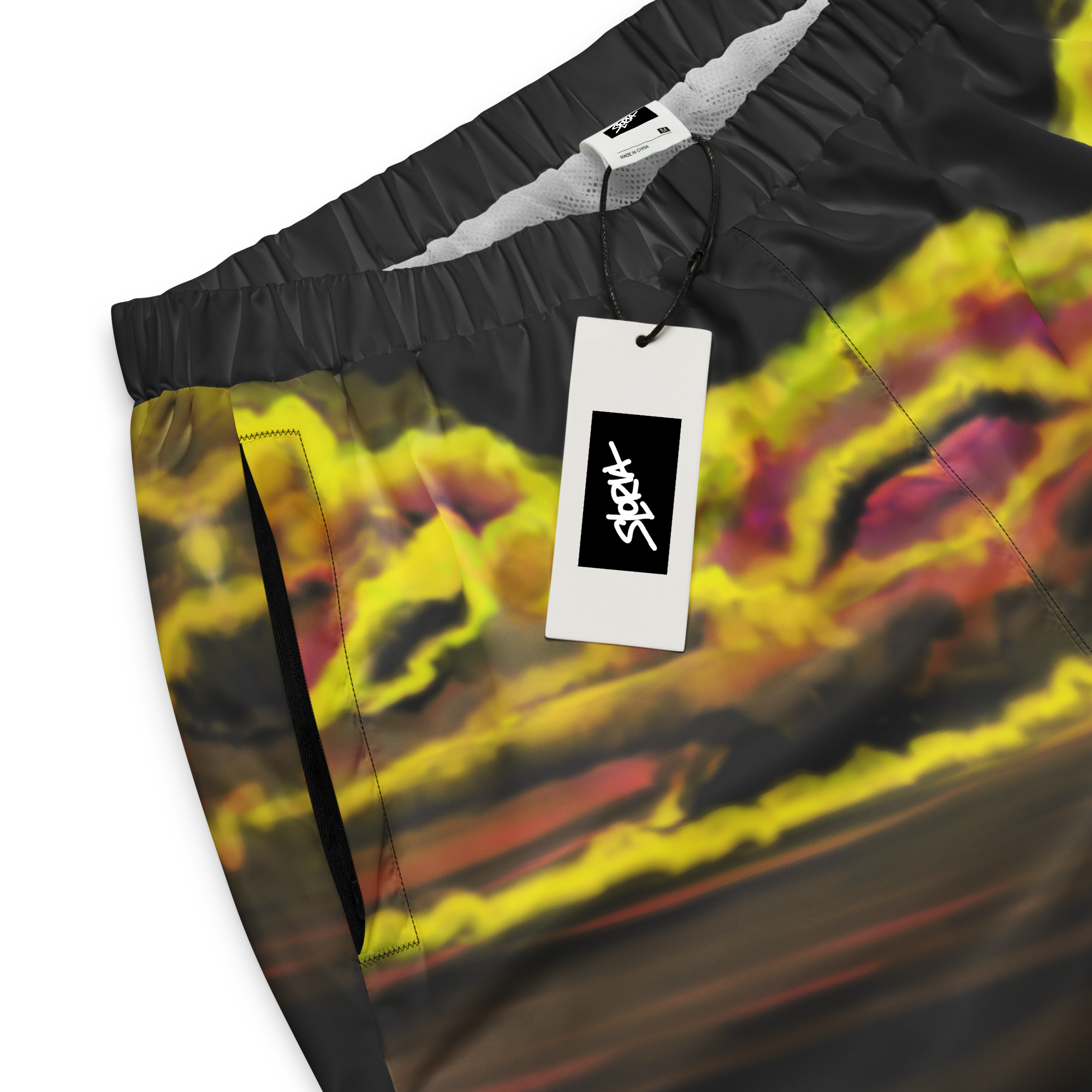 Colorful shorts with a brand Loria NYC Art tag on a white background