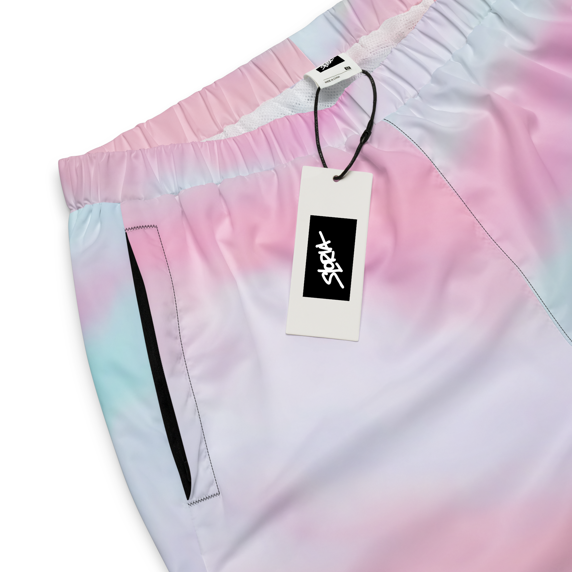 Gradient Loria NYC Art pants with pink to blue color transition, featuring a brand tag.
