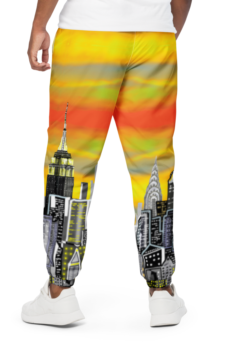 Person wearing a colorful Loria NYC Art sweatshirt with cityscape design on a white background