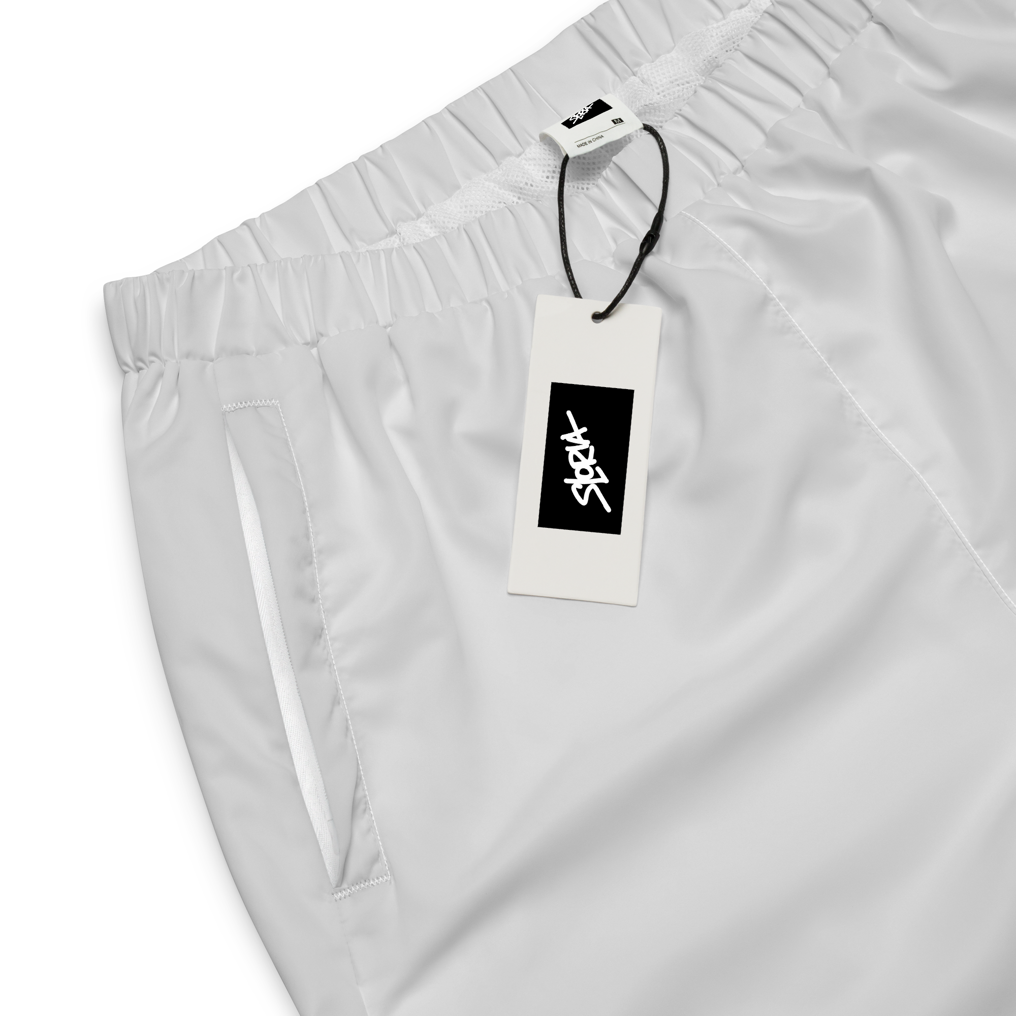White pants a brand tag Loria NYC Art on a white background