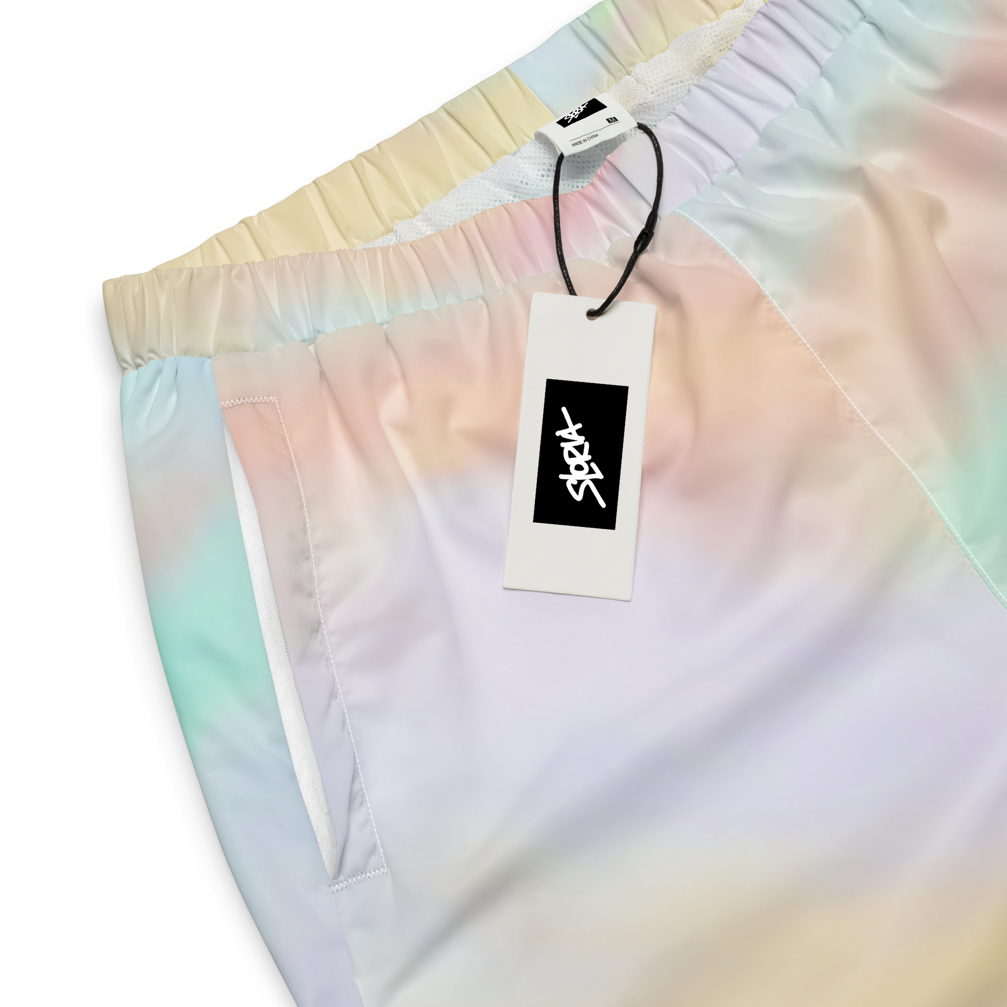 Colorful tie-dye shorts with a Loria NYC Art brand tag on a white background