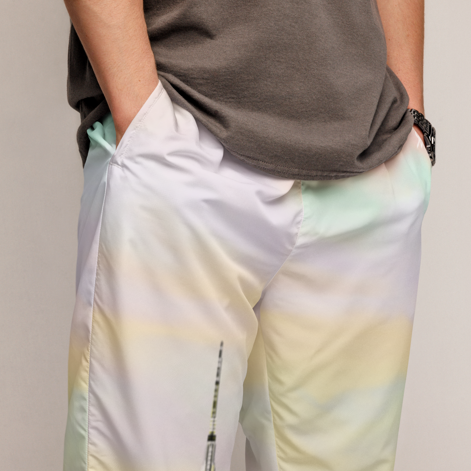Person wearing a brown shirt and gradient Loria NYC Art pants with pastel colors.