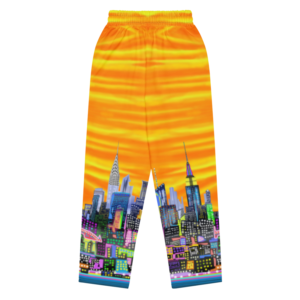 Colorful pants with a Loria NYC Art cityscape design on a white background