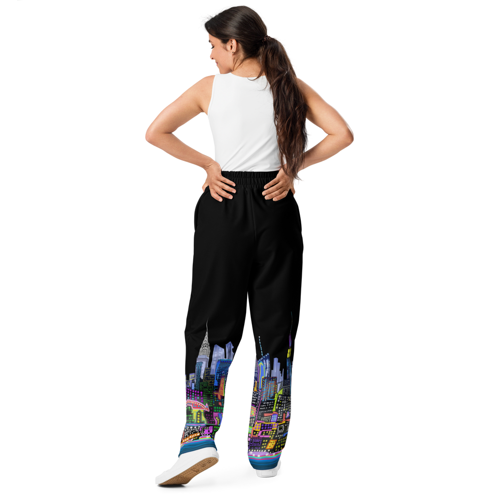 Woman wearing black pants with colorful cityscape Loria NYC Art design on a white background