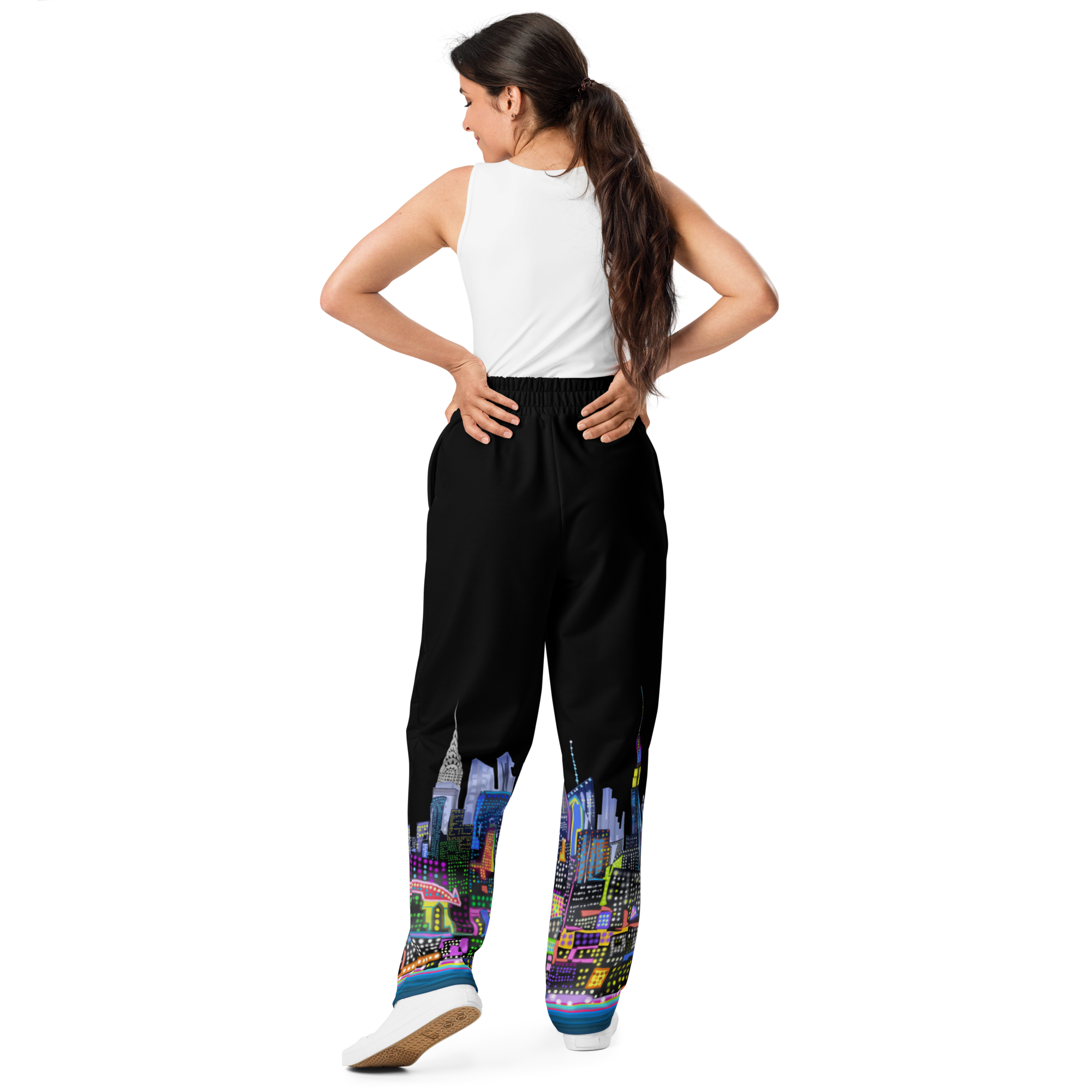 Woman wearing black pants with colorful cityscape Loria NYC Art design on a white background