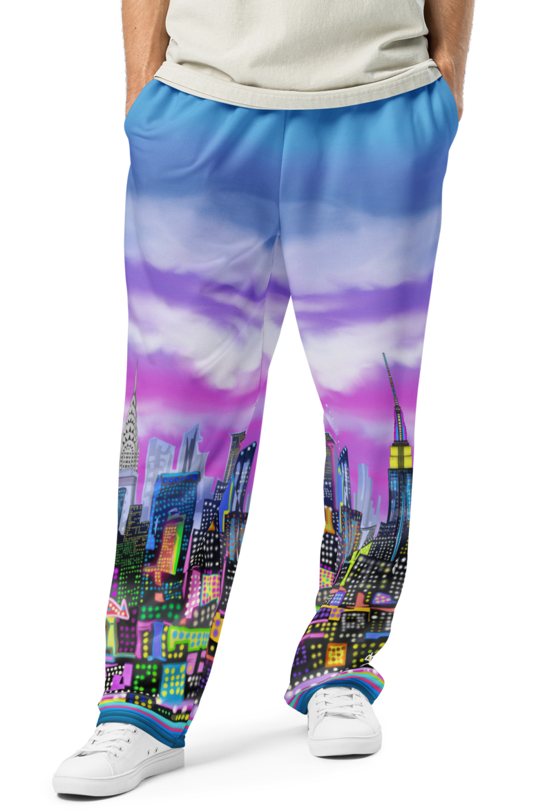 Person wearing a light gray t-shirt and colorful cityscape Loria NYC Art pants on a white background
