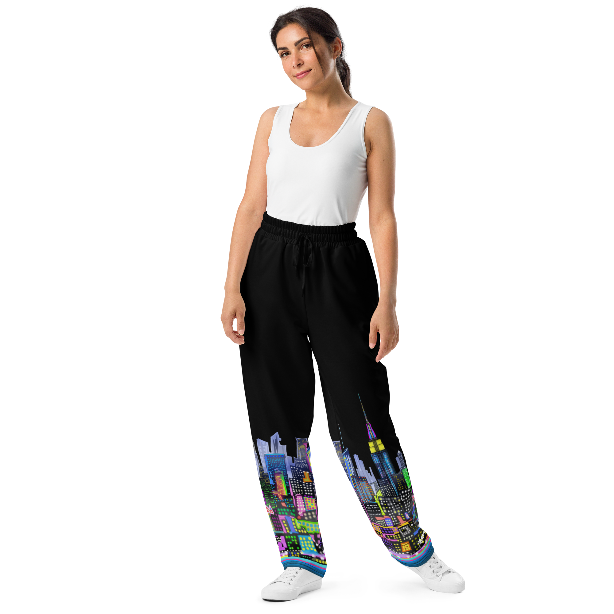 Woman wearing black pants with Loria NYC Art colorful cityscape design on a white background