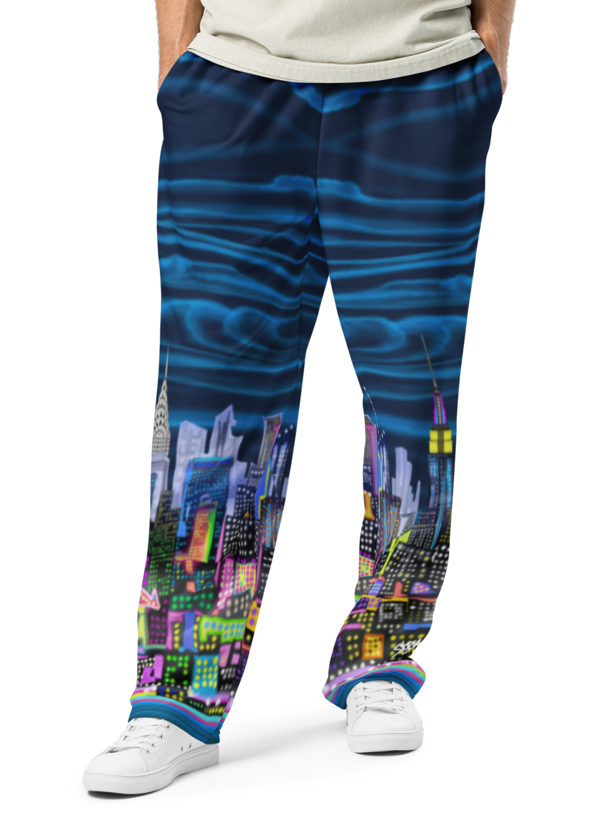Person wearing a white t-shirt and blue pants with Loria NYC Art cityscape design on a white background