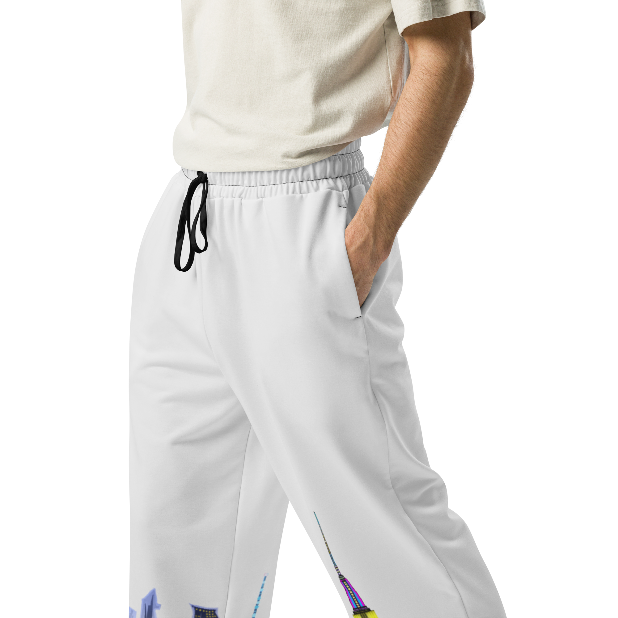 Person wearing light gray Loria NYC Art pants with colorful accents on a white background