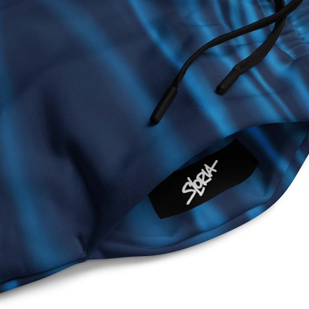 Blue fabric with a black tag featuring the Loria NYC Art brand 'SLoria' on a white background