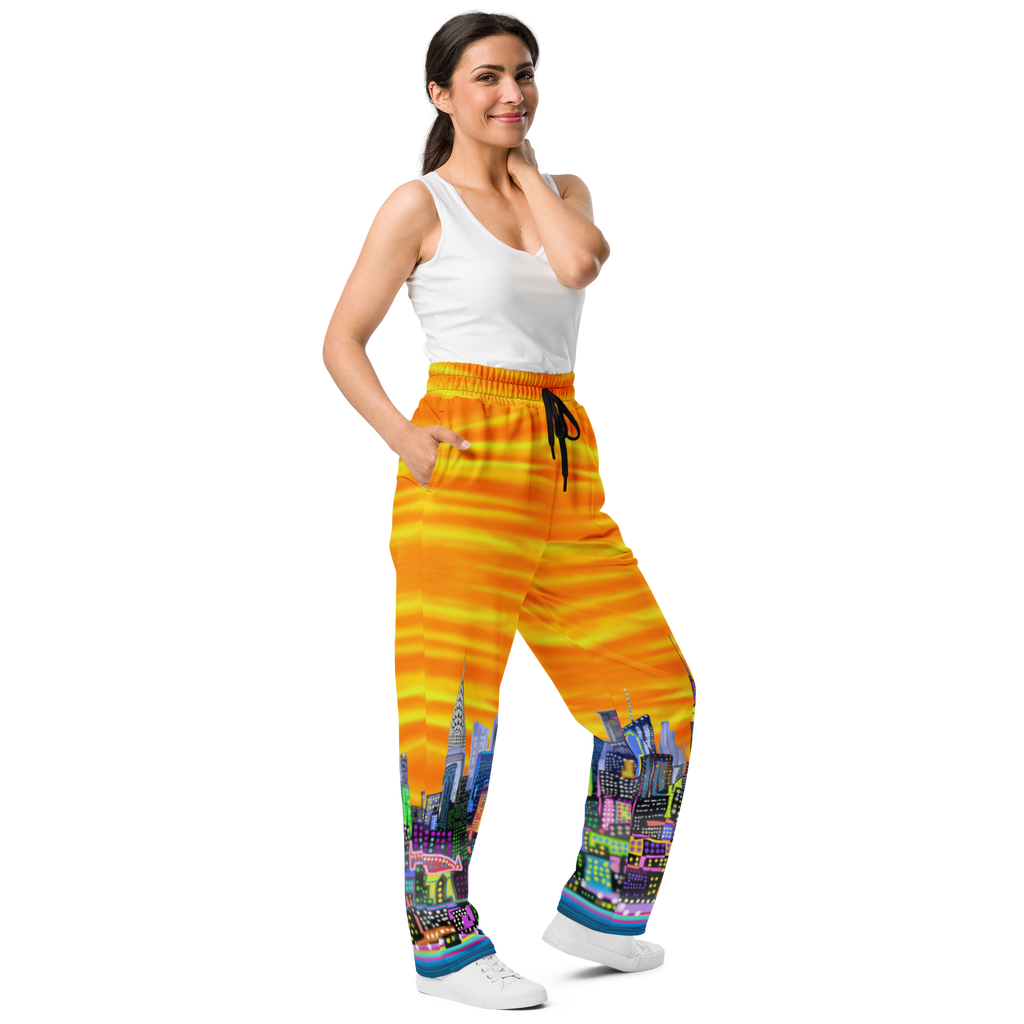 Woman wearing colorful pants with a Loria NYC Art cityscape design on a white background