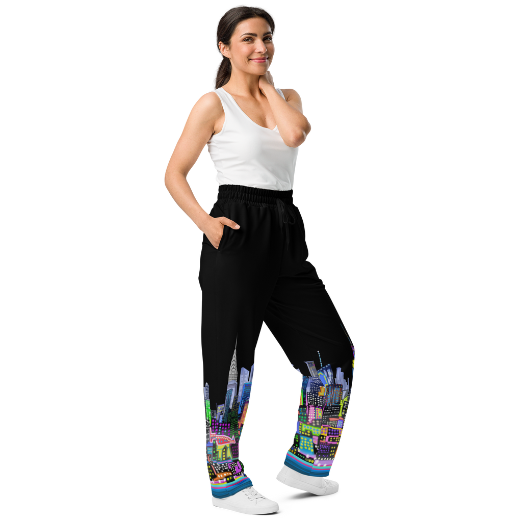 Woman wearing black pants with colorful cityscape Loria NYC Art design on a white background