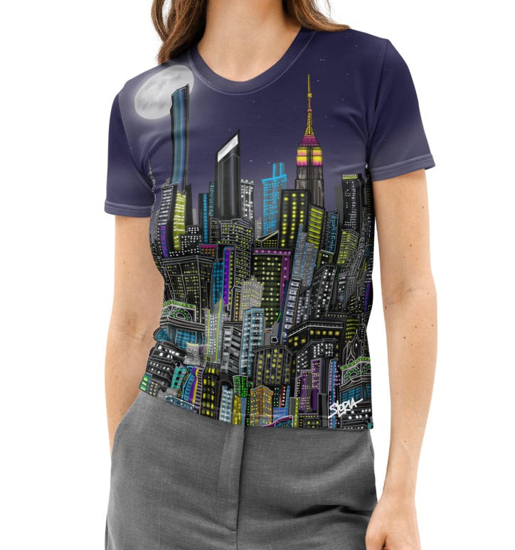 Woman wearing a Loria NYC Art cityscape t-shirt on a white background