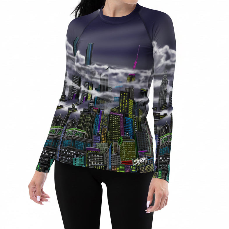  Front of women wearing a colorful Loria NYC Art shirt on a white background.