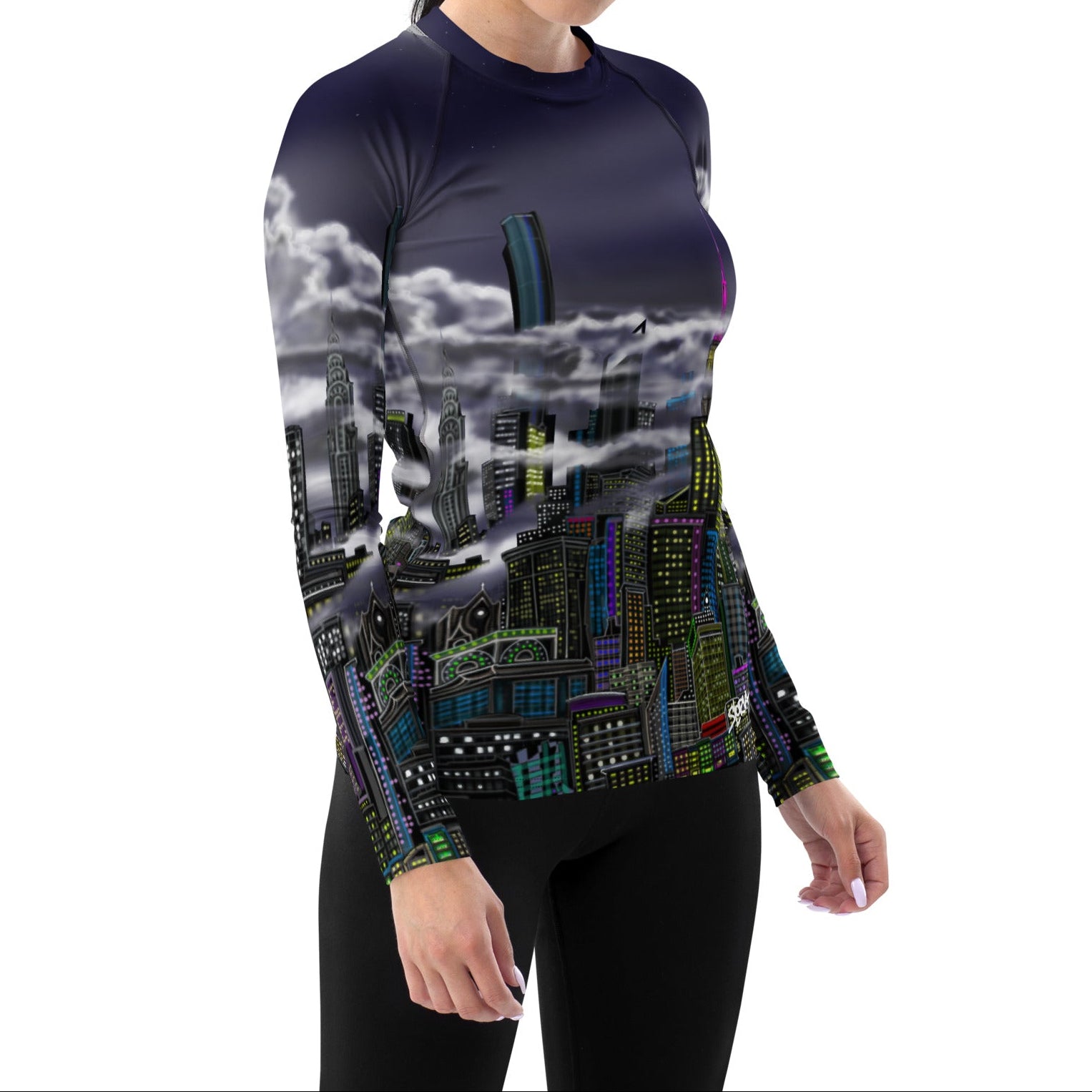 Women posing in a Loria NYC Art shirt on a white background.