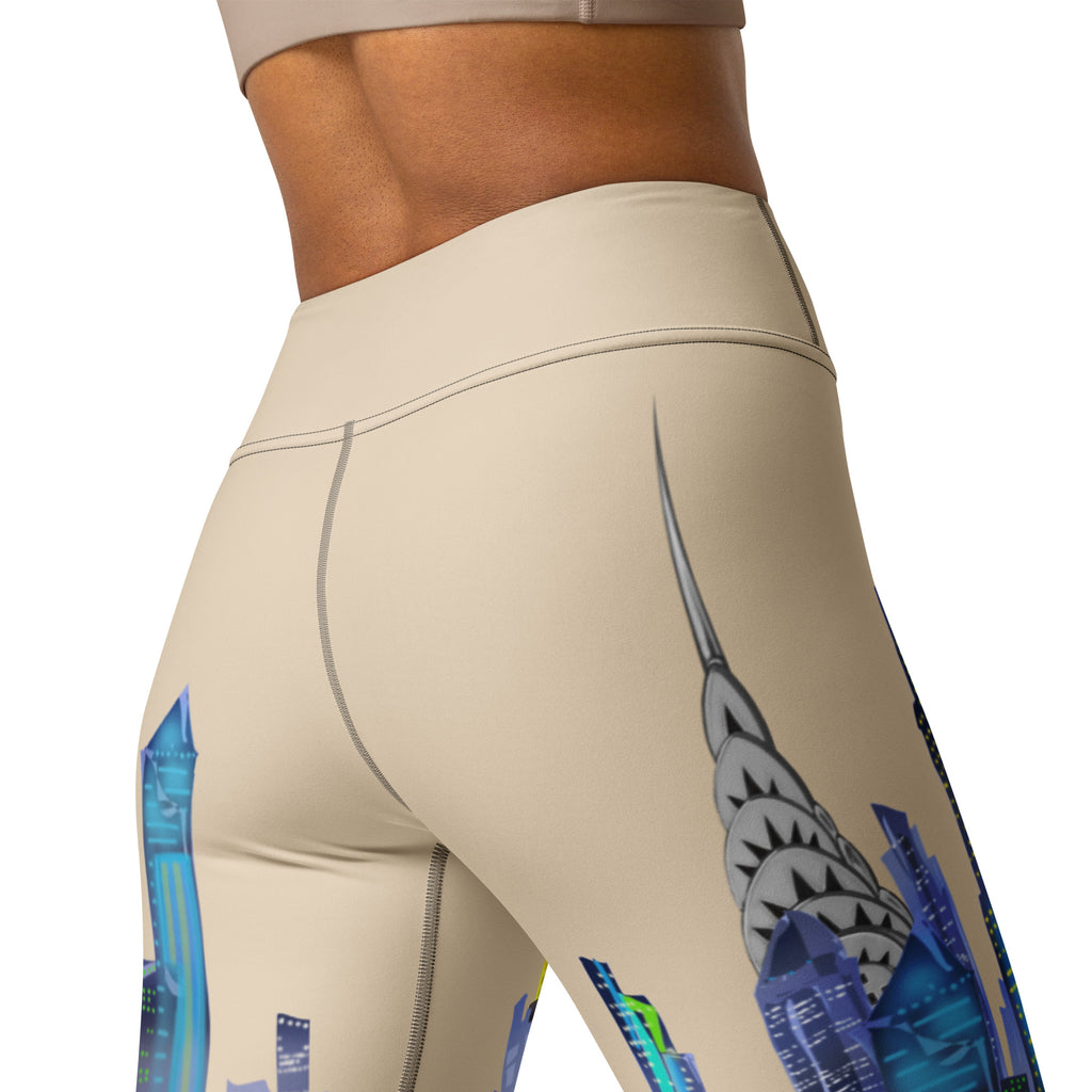 Beige leggings with colorful Loria NYC Art geometric designs on a white background
