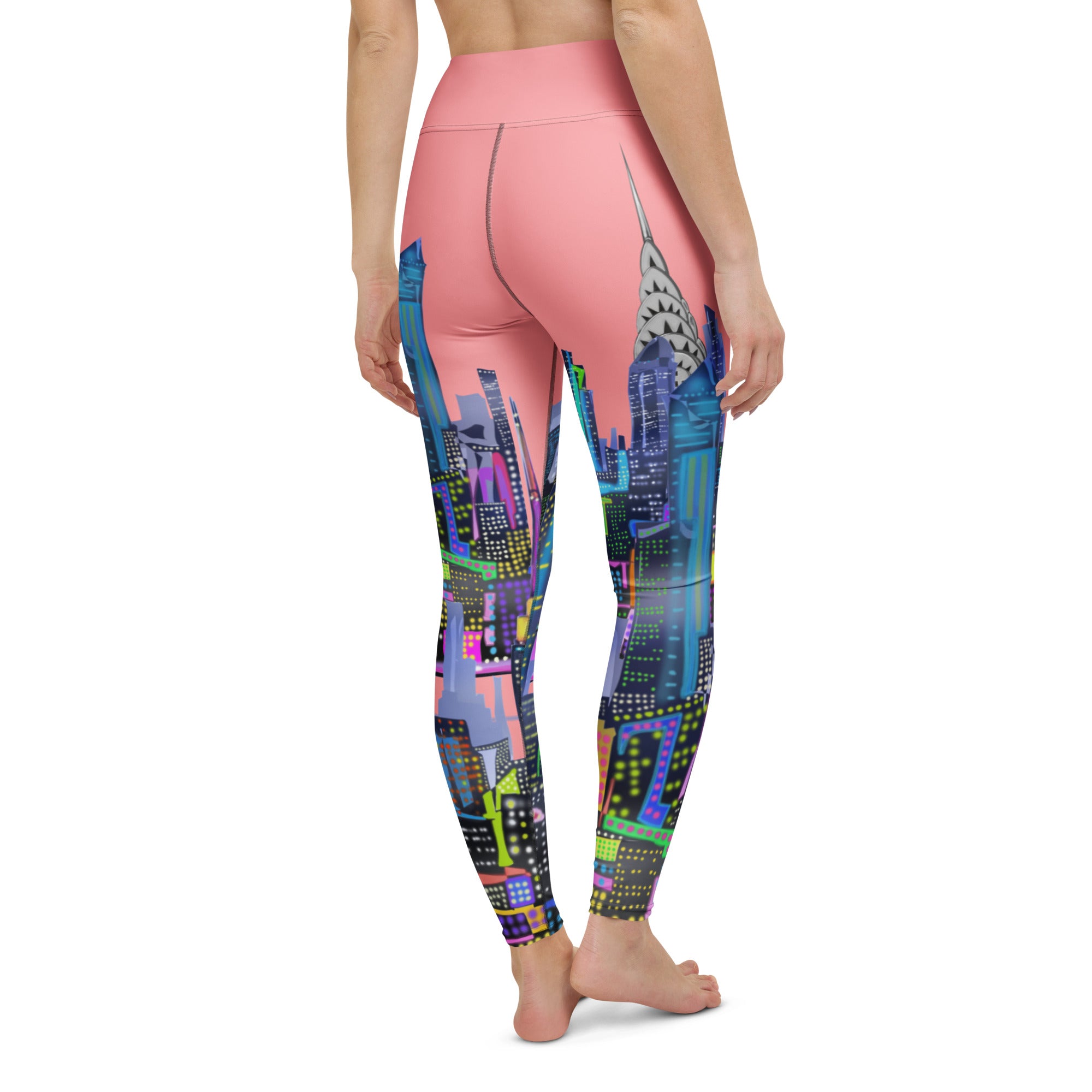 Leggings with colorful pink Loria NYC Art cityscape design on a white background